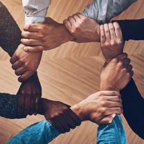 Diverse workforce collaboration supporting government contractor sustainability through inclusive growth, training, and community-driven development